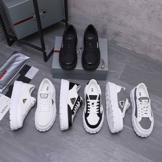 商品商标：Prada [普拉达] 休闲鞋 正码.码数: 38-45 45.定做不退换 商品材料：精选 珠光牛皮搭配透气网鞋面 牛皮鞋垫 牛皮内里 原版大底