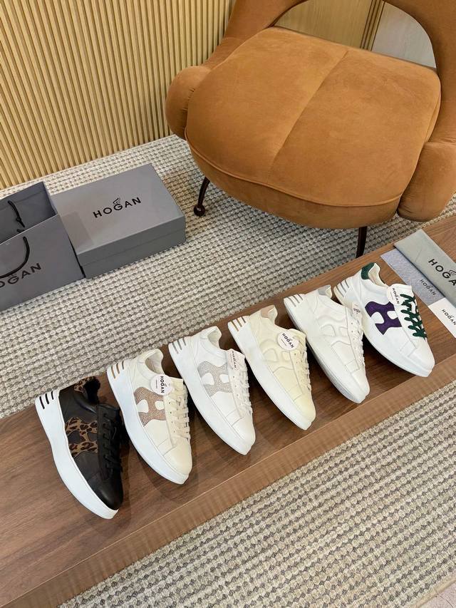 Hogan霍根经典运动鞋将优雅与现代感融为一体，颜色搭配丰富色彩点缀，侧面带有标志性的Hogan标志，这个运动鞋采用纤细剪裁，细微缝线增添质感，细带设计带来经典